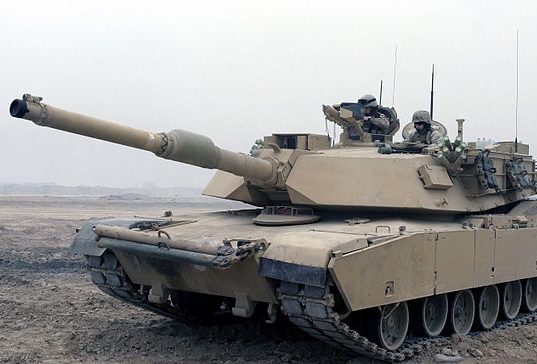 U.S. Marines perform premission checks on an M1A1 Abrams Tank